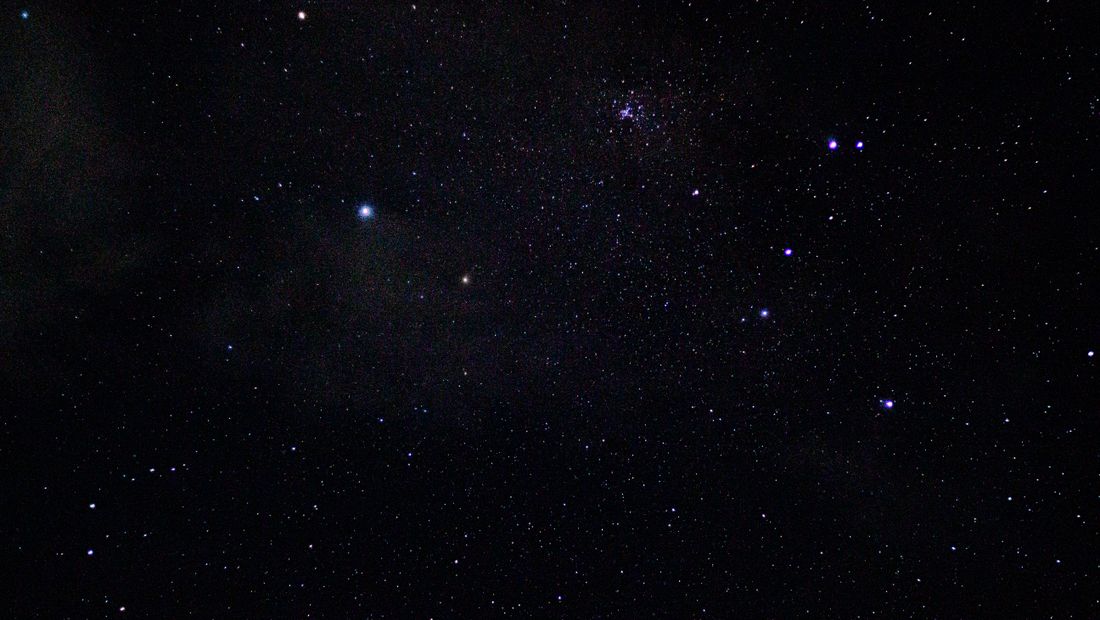 A clear night sky filled with stars and constellations