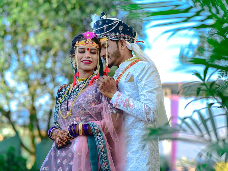 A couple in traditional Indian wedding dress